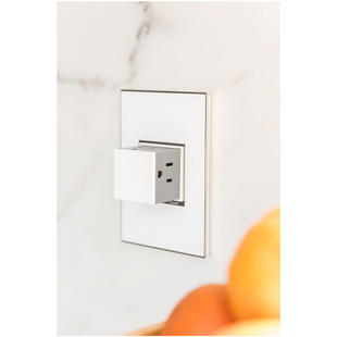 adorne Collection mirror white wall plate with pop out outlet installed in marble white backsplash