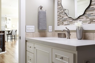 adorne Collection Mirror white on white wall plate in neutral bathroom