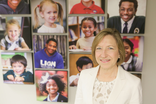 Mandy Rough, executive director of the Memphis Opportunity Scholarship Trust (MOST), in front of a gorgeous photo collage of MOST students. Mandy Rough, executive director of the Memphis Opportunity Scholarship Trust (MOST), in front of a gorgeous photo collage of MOST students.